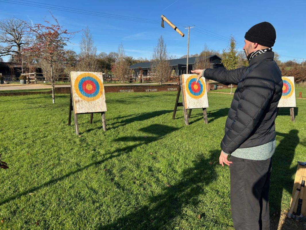 delegates competing in an axe throwing teambuilding event at Silchester Farm in Hampshire