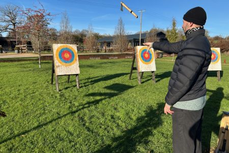 delegates competing in an axe throwing teambuilding event at Silchester Farm in Hampshire